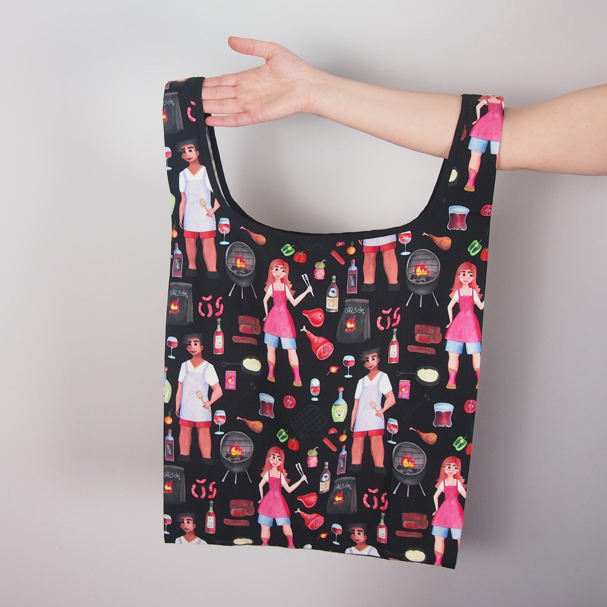 Tote bag with a pattern of people at a barbecue on a plain background